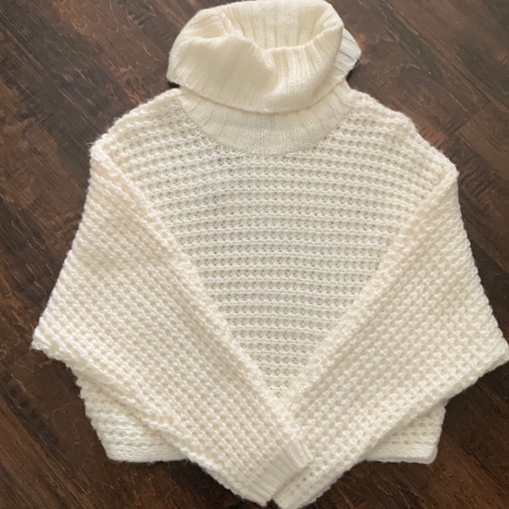 Cream colored sweater.